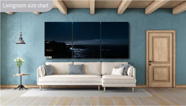 A living room with a couch and a wall hanging