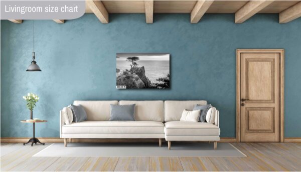A living room with a couch and a painting on the wall