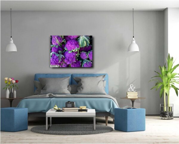 A bedroom with blue furniture and purple flowers on the wall.