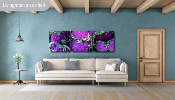 A living room with a couch and wall art