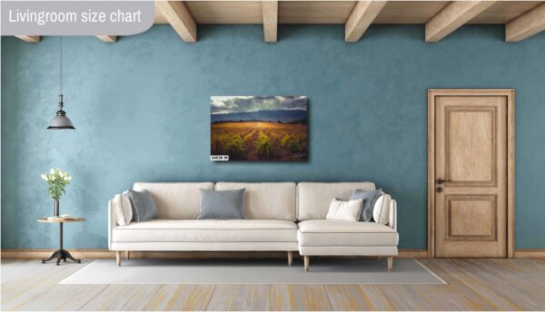 A living room with a couch and a painting on the wall