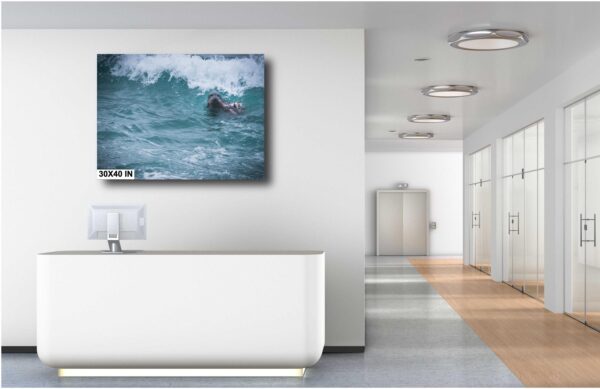 A bathroom with a white tub and a large picture on the wall.
