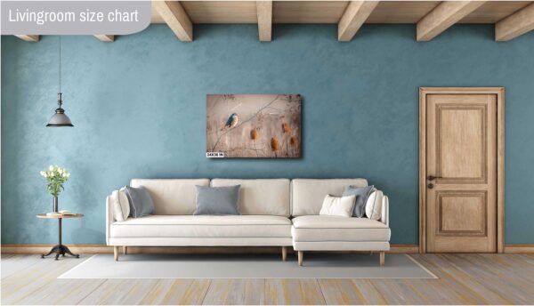 A white couch sitting in front of a blue wall.