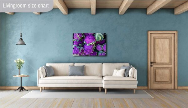 A living room with a couch and a painting on the wall