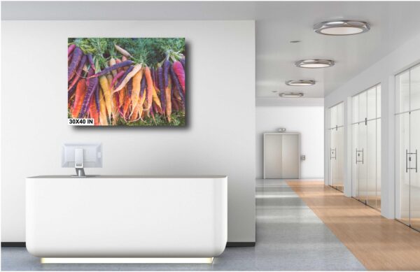 A white room with a large painting of carrots.