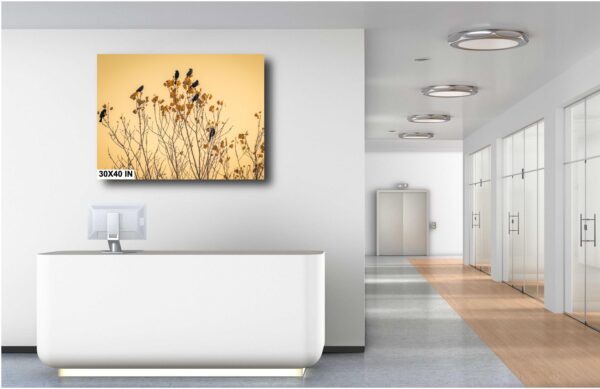 A bathroom with a white tub and a painting on the wall.