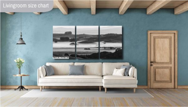 Black and white image of fog rolling over hills and a farmhouse in Sonoma County, California